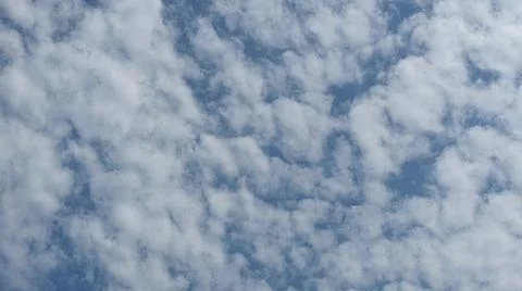 Beautiful blue sky with patterned altocumulus clouds Stock Photos