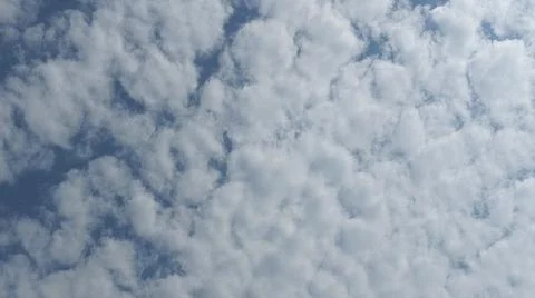 Beautiful blue sky with patterned altocumulus clouds Stock Photos