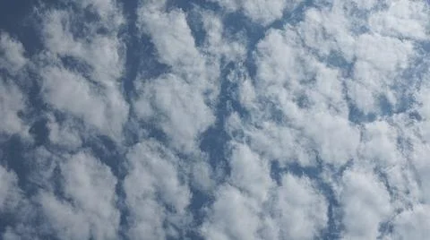 Beautiful blue sky with patterned altocumulus clouds Stock Photos