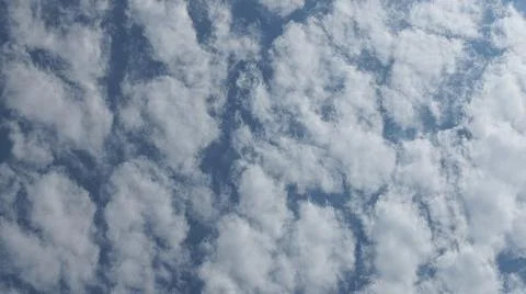 Beautiful blue sky with patterned altocumulus clouds Stock Photos