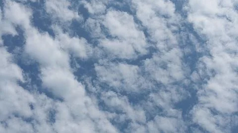 Beautiful blue sky with patterned altocumulus clouds Stock Photos