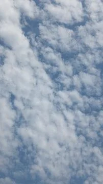 Beautiful blue sky with patterned altocumulus clouds Stock Photos