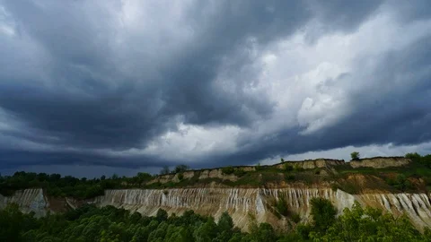 Beautiful blue sky with running clouds. Old abandoned chalk quarry. Stock Footage 104710307