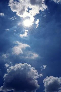 Beautiful blue sky with sunbeam with cloudy, ray of hope. Deep blue sky. Stock Photos