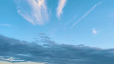Beautiful Blue Sky With White Cirrus Clouds And Dark Moody Storm Clouds Footage Stock Footage 337592248