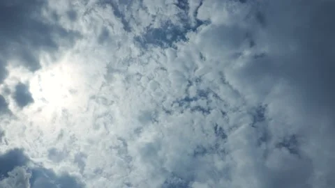 Beautiful blue sky with white clouds and sun Stock Footage 143704972