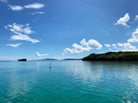 Beautiful blue sky, white clouds, and the quiet Okinawa sea 01 Stock Photos