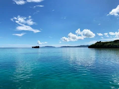 Beautiful blue sky, white clouds, and the quiet Okinawa sea 02 Stock Photos
