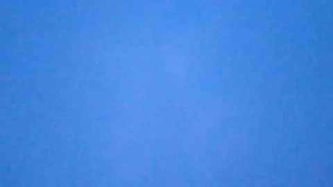 Beautiful blue twilight sky with soft glowing clouds during dusk Stock Footage 340787061