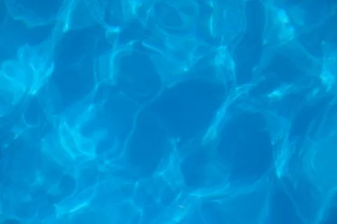 Beautiful blue water background. Texture of water surface of pool is transparent Stock Photos