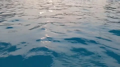 Beautiful blue water surface with sunlight reflections and soft ripples Stock Footage 342475927