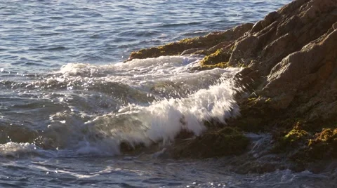Beautiful blue waves crashing into the coast Stock Footage