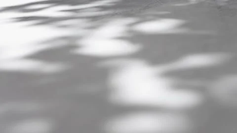 Beautiful blurred background with bokeh from sunlight on a gray wall. Video stock 203931702