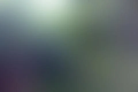 A beautiful, blurred background featuring a purple and green gradient Stock Photos