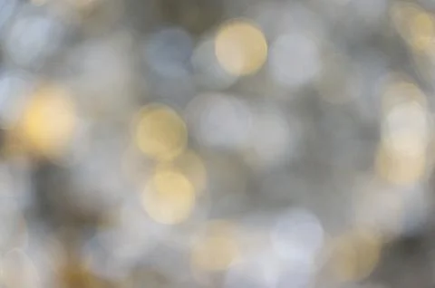 Beautiful blurred background of lights creating a soft bokeh effect in natural Stock Photos
