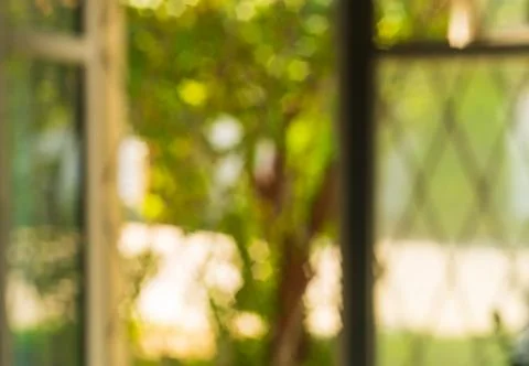 Beautiful blurred background overlooking the defocused window frames, behind  Stock Photos