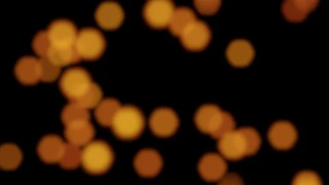 Beautiful bokeh background with flying blurred golden lights (4K) Video stock 104601679