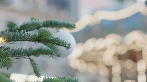Beautiful Bokeh Carousel Seen Through Christmas Tree Holiday Lights Stock Footage 323142151