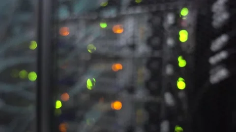 Beautiful bokeh. Server rack with flashing lights. Video contains noise 動画素材 142313088