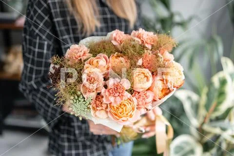 Beautiful bouquet of mixed flowers in woman hand. Floral shop concept . Handsome Stock Photos