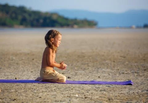 Beautiful boy on the beach Stock Photos