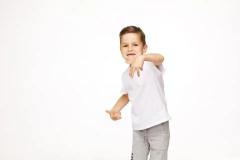 Beautiful boy is dancing on a white background Stock Photos