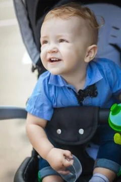Beautiful boy in pram Stock Photos