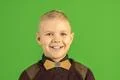 The beautiful boy smile on the green background Photo