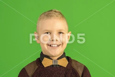 The beautiful boy smile on the green background Stock Photos