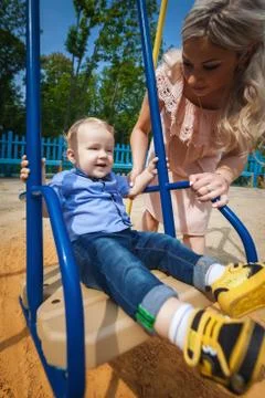 Beautiful boy on swing Stock Photos