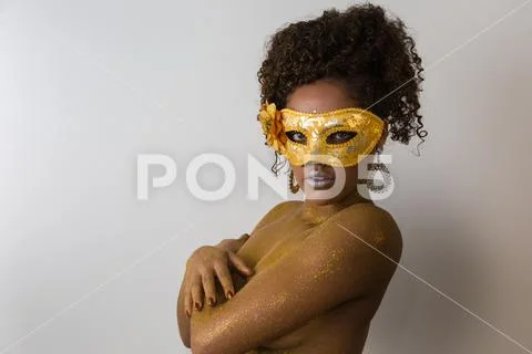 Beautiful Brazilian afro girl ready for the carnival. Golden body painting. F Stock Photos
