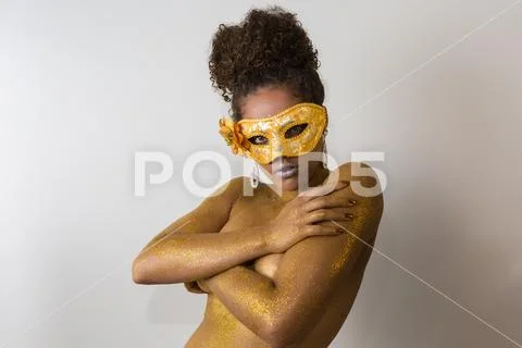 Beautiful Brazilian afro girl ready for the carnival. Golden body painting. F Stock Photos