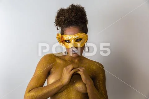 Beautiful Brazilian afro girl ready for the carnival. Golden body painting. F Stock Photos