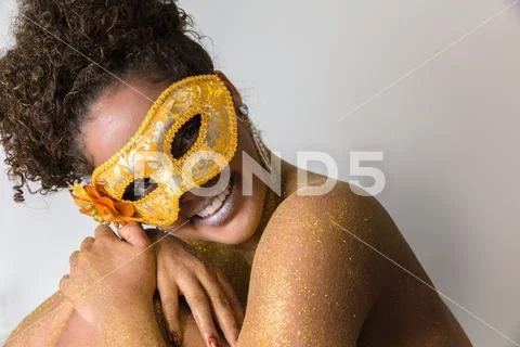 Beautiful Brazilian afro girl ready for the carnival. Golden body painting. F Stock Photos