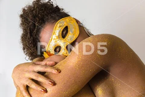 Beautiful Brazilian afro girl ready for the carnival. Golden body painting. F Stock Photos