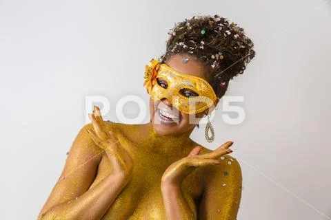 Beautiful Brazilian afro girl ready for the carnival. Golden body painting. F Stock Photos