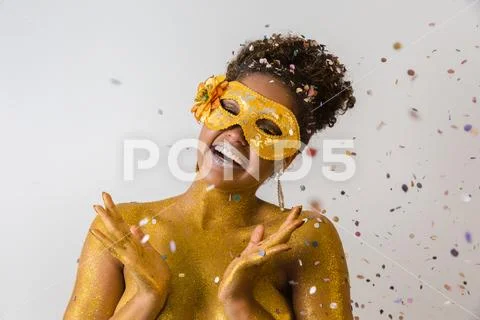 Beautiful Brazilian afro girl ready for the carnival. Golden body painting. F Stock Photos