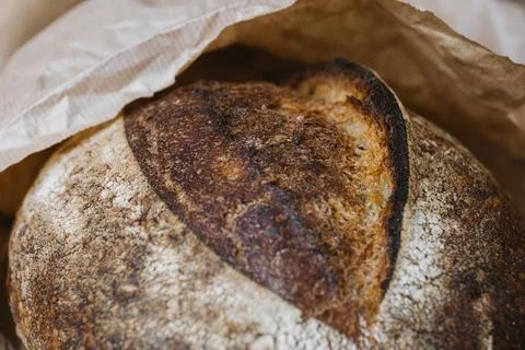 Beautiful bread close-up. Bread from shop in craft package. Grain surface Stock Photos
