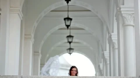 Beautiful bride approaching and throws the wedding flower bouquet Stock Footage 24673352