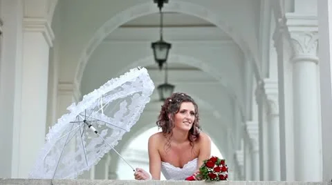Beautiful bride on the balcony of the castle Stock Footage 24673349