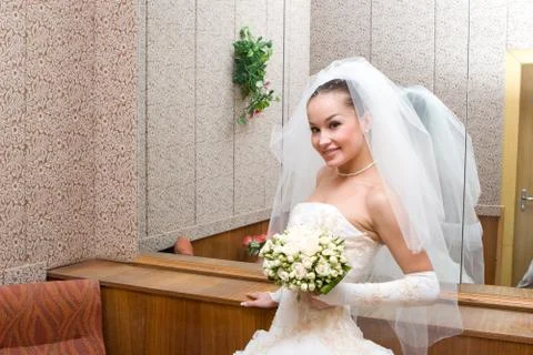 Beautiful bride by a big mirror Stock Photos