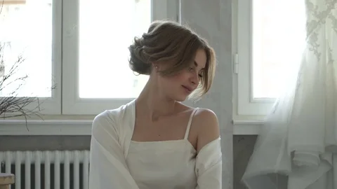 Beautiful bride in a dressing gown Stock Footage 70037968
