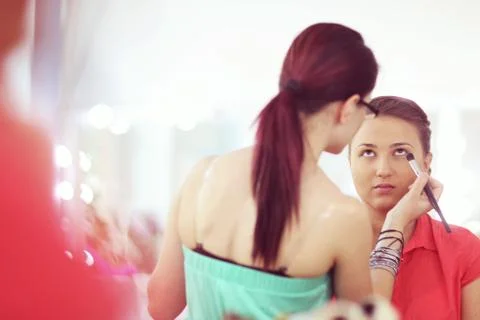 Beautiful bride getting professional make up Stock Photos