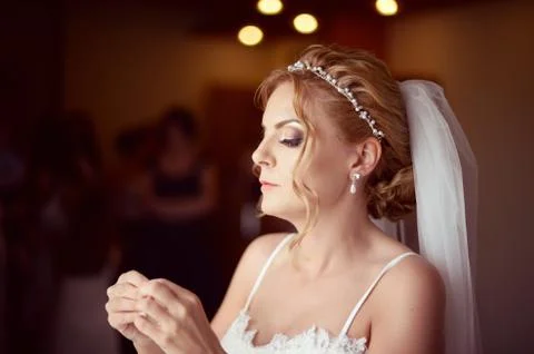 Beautiful bride getting ready for her wedding Stock Photos