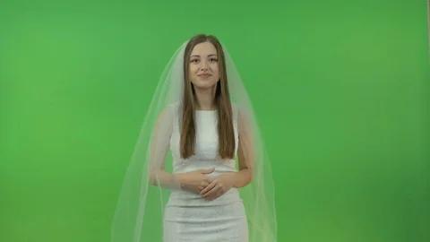 Beautiful bride on a green background. Video stock 83519593
