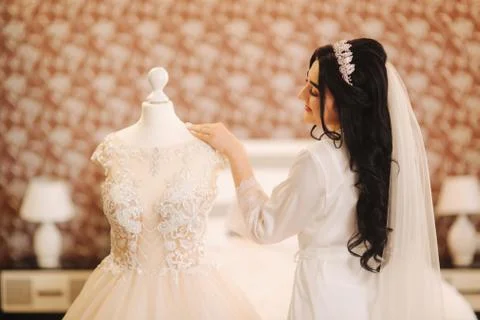 Beautiful bride on her wedding day. Wedding dress on bride. Smile and relax Stock Photos