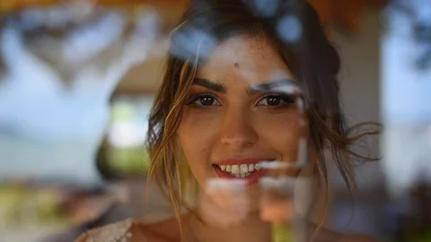 Beautiful bride with makeup and hairstyle smiling at camera Stock Footage