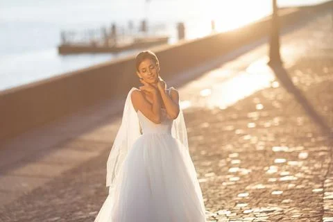 Beautiful bride posing against the backdrop of a European city Stock Photos