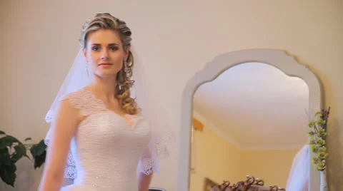 Beautiful bride posing for the camera Video stock 63760565
