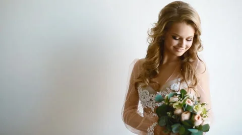 Beautiful bride posing near the window Stock Footage 67623570